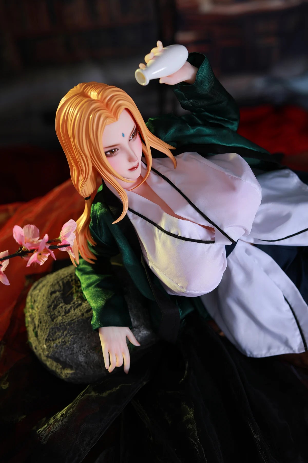 Blonde anime doll in green